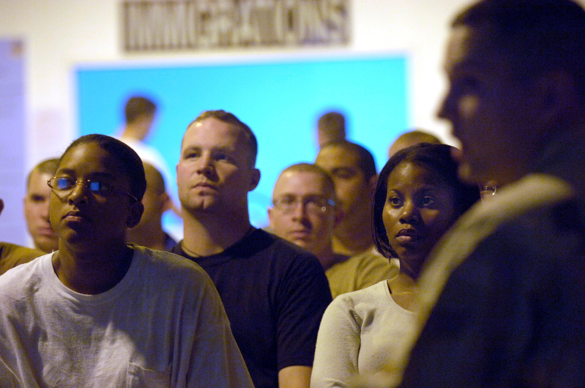 Following a 24-plus hour flight from the United States, (left to right) Senior Airmen Tolera Jarman and Matt Eggleston and Staff Sgt. Vickie Sennet receive an inprocessing briefing at a forward-operating base in Southwest Asia Sept. 17 from Senior Airman David Shwalb. (U.S. Air Force photo/Master Sgt. Scott Wagers) 

