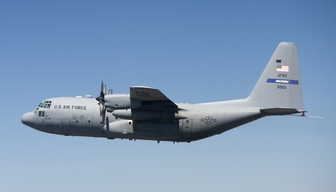 A specially modified C-130 Hercules flies over the Texas countryside Sept. 19 during its initial test flight.  The Hercules, which took off from Lackland Air Force Base, Texas, was modified under the C-130 Avionics Modernization Program which included a comprehensive upgrade of the avionics system that increases situational awareness for the warfighter tenfold over old analog cockpits, dramatically increasing information available to aircrews at a glance, simplifying tasks and decreasing workload.  (Boeing photo/Ron Bookout)