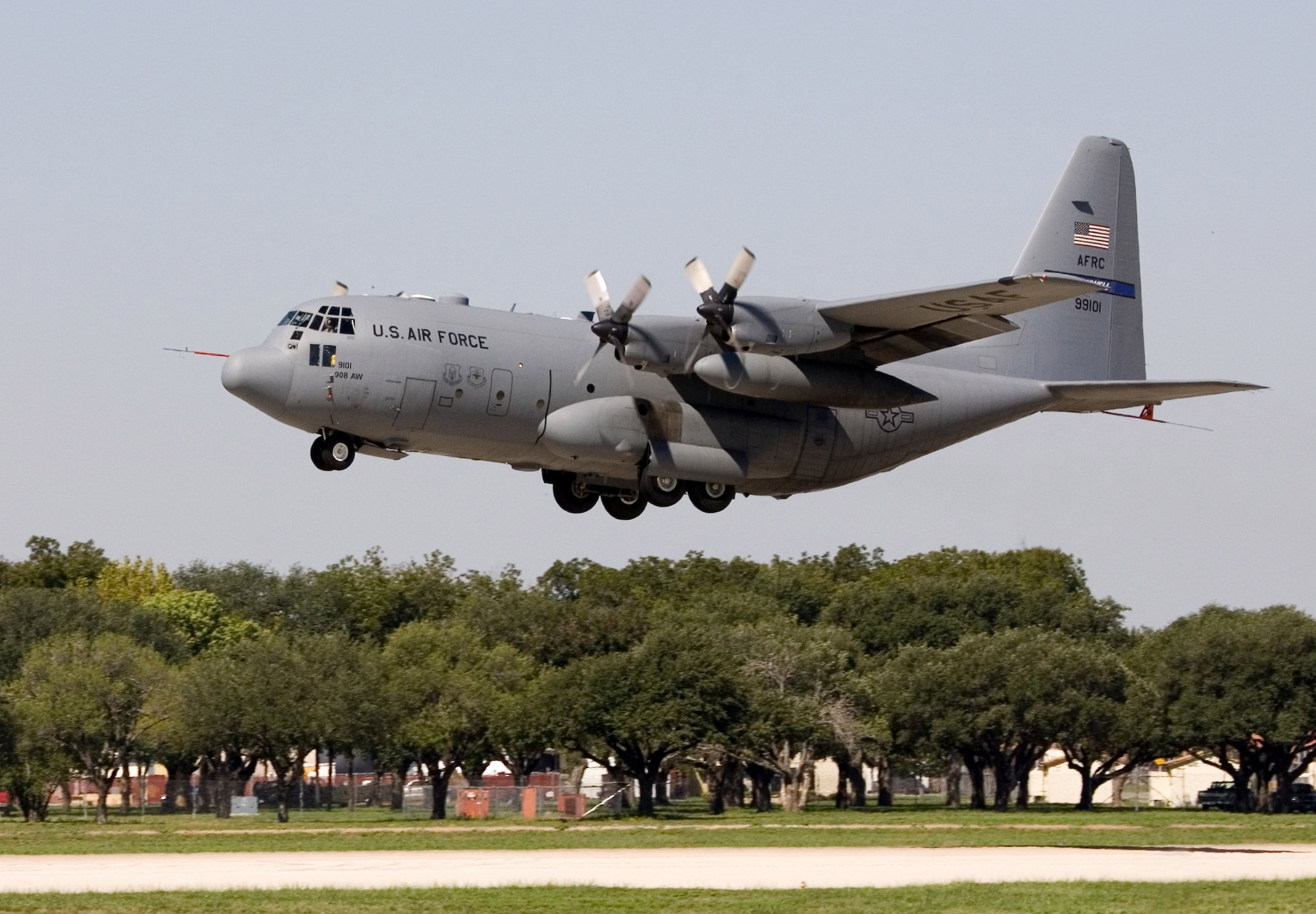 A specially modified C-130 Hercules takes off from Lackland Air Force Base, Texas, Sept. 19, for its initial test flight.  The Hercules was modified under the C-130 Avionics Modernization Program which included a comprehensive upgrade of the avionics system that increases situational awareness for the warfighter tenfold over old analog cockpits, dramatically increasing information available to aircrews at a glance, simplifying tasks and decreasing workload.  (Boeing photo)