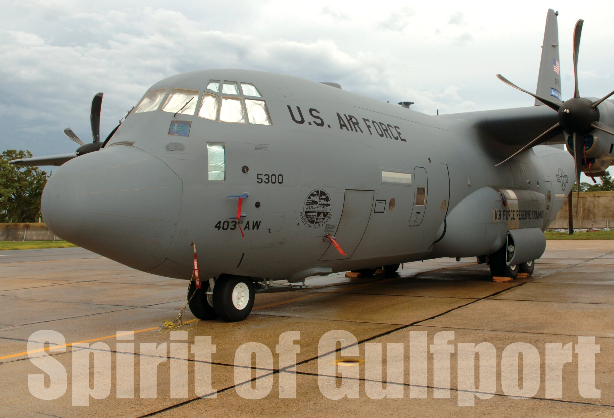 The 403rd Wing dedicated one of its WC-130J "Hurricane Hunter" aircraft to the city of Gulfport Sept. 20, 2006. Mayor Brent Warr, Gulfport, accepted a placque on behalf of the city and helped Brig. Gen. Richard Moss unveil nose art of the city's logo.  