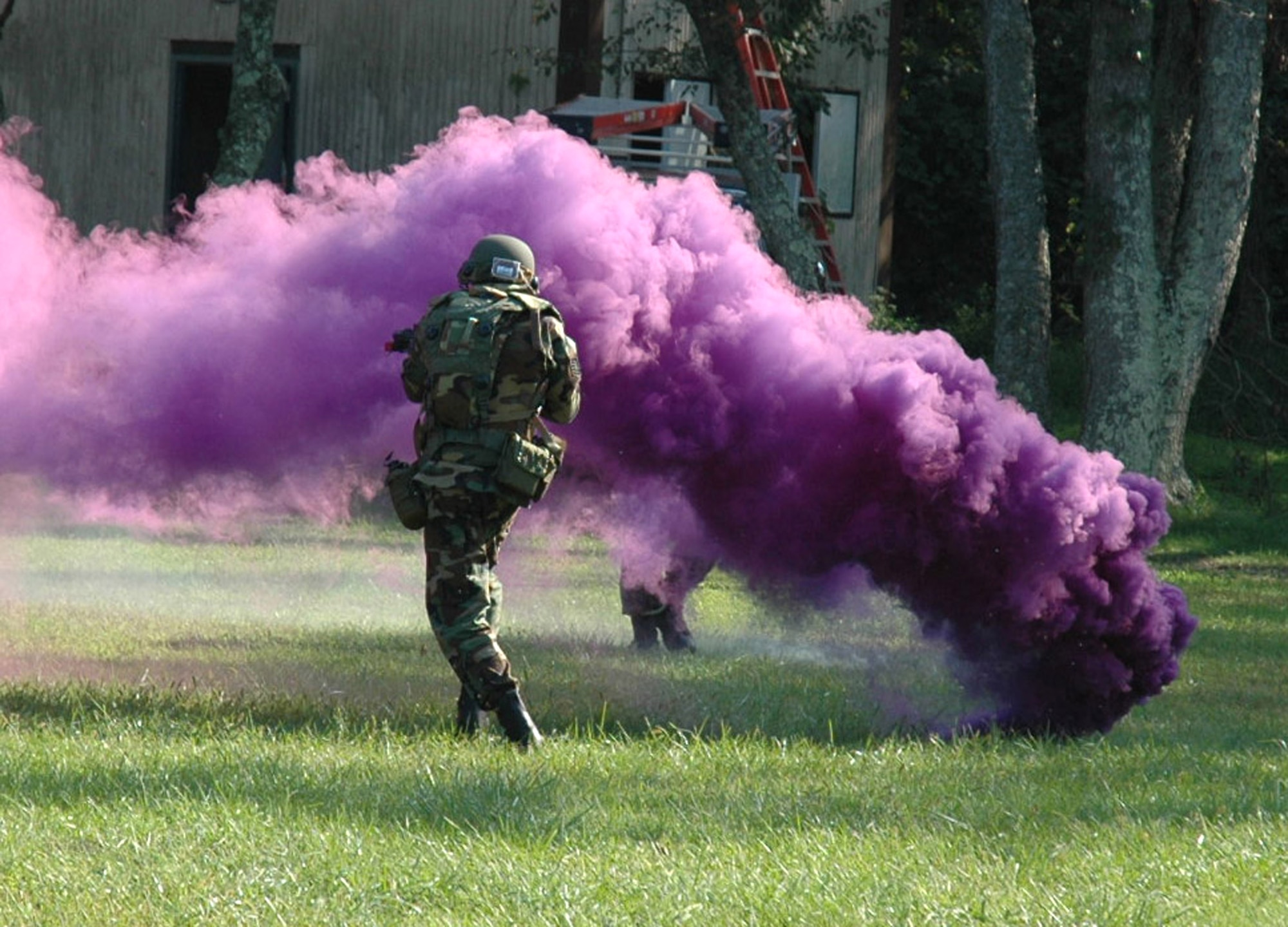 A student in the Air Mobility Warfare Center's Advanced Contingency Skills Training Course 06-5 at Fort Dix, N.J., deploys smoke during a training session at a tactical range there Sept. 18. More than 60 Airmen are participating in the training course, learning numerous combat-related skills including tactics, media skills, convoy operations, first aid, and field craft. The course is taught by the AMWC's 421st Combat Training Squadron.  (U.S. Air Force photo/Tech. Sgt. Scott T. Sturkol)