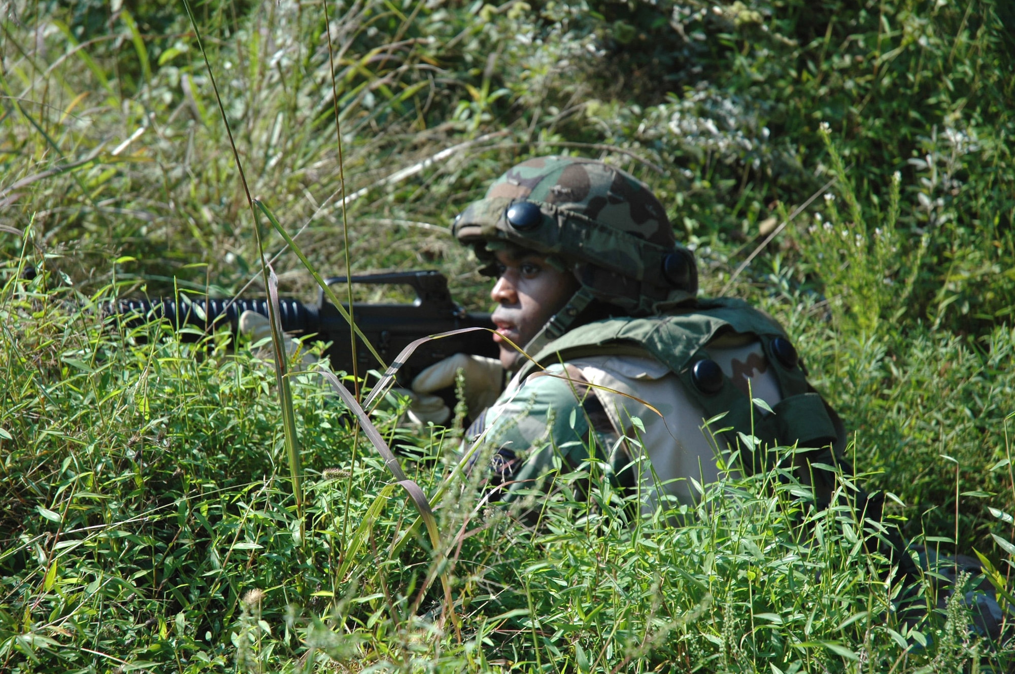 A student in the Air Mobility Warfare Center's Advanced Contingency Skills Training Course 06-5 at Fort Dix, N.J., practices combat patrolling during a training session at a tactical range there Sept. 18. More than 60 Airmen are participating in the training course, learning numerous combat-related skills including tactics, media skills, convoy operations, first aid, and field craft. The course is taught by the AMWC's 421st Combat Training Squadron.  (U.S. Air Force photo/Tech. Sgt. Scott T. Sturkol)