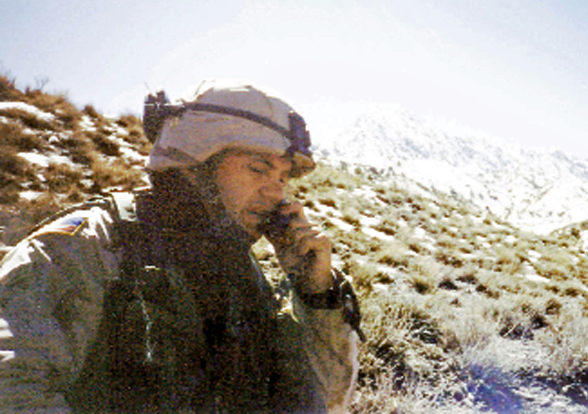 In this photo taken under extreme conditions in Afghanistan, Tech. Sgt. Stephen Achey talks to military officials while assigned to Bagram Air Base in 2002. Sergeant Achey was awarded the Silver Star for his actions in Afghanistan and received the Keeper of the Flame Award from the chairman of the Joint Chiefs of Staff Sept. 20 for his efforts in fighting the war on terrorism. (Courtesy photo)