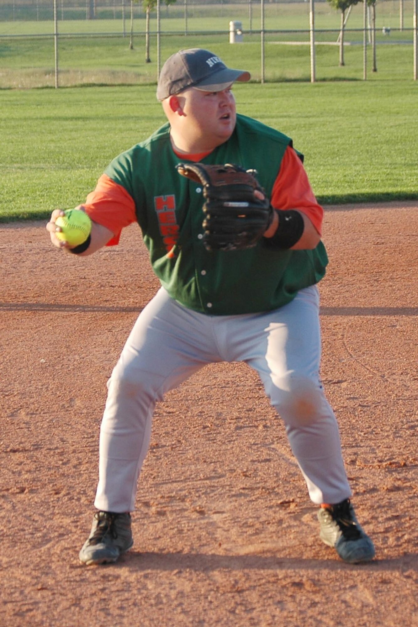 PETERSON AIR FORCE BASE, Colo. (AFRC) -- Hercs third baseman Steve Anaya prepares to throw to first after snagging a grounder at the hot corner. (U.S. Air Force photo by Tech. Sgt. Tim Taylor)
