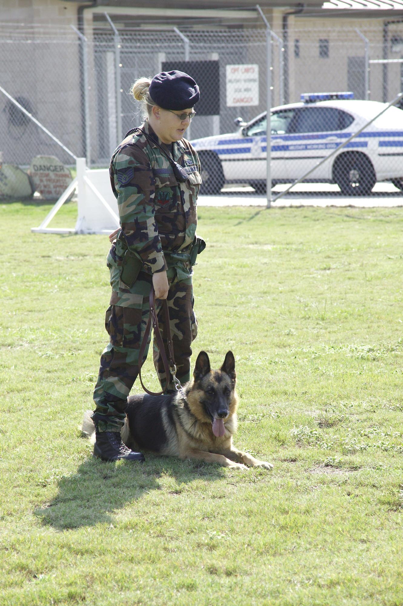 Staff. Sgt. Rebecca Turnbull, 20th SFS MWD handler, commands her dog, Zeus, to the position “parade rest.”  (U.S. Air Force photo/Senior Airman Holly MacDonald)