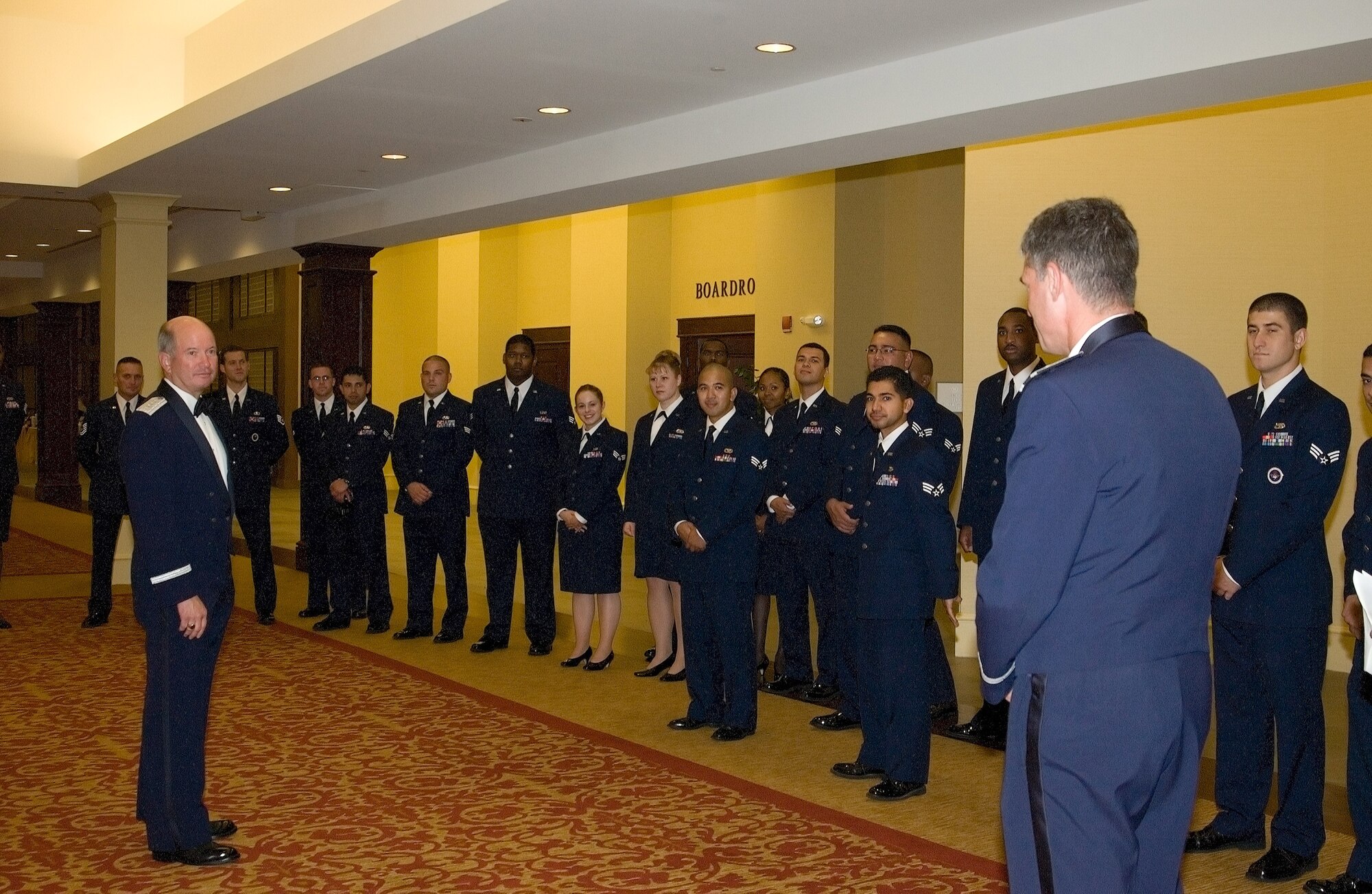 General McNabb and Col. Sam Cox, 436th Airlift Wing commander, meet with Dover Air Force Base’s Airman Leadership School Class 06-H during the Air Force Ball Saturday at the Sheraton in Dover. The class volunteered to escort, greet, and check coats for the ball as a part of a mandatory ALS community project. (U.S. Air Force photo/Jennie Hess)