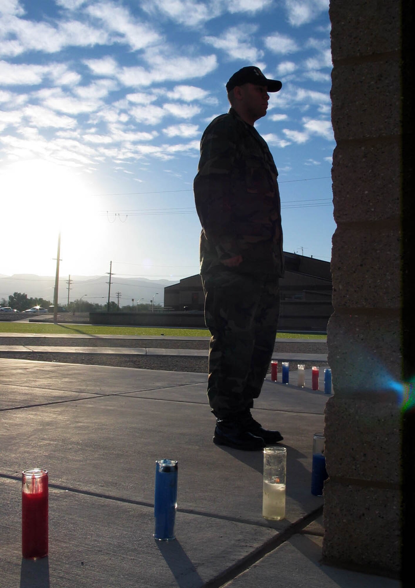 Senior Airman Christopher Lawrimore, 49th Materiel Maintenance Group, stands vigil in front of the POW/MIA Memorial at Holloman’s Heritage Park early morning of Sept. 20 as part of the base’s POW/MIA commemoration.  Holloman Airmen stood watch at the memorial for 24 hours beginning at midnight.  (Photo by Tom Fuller)

