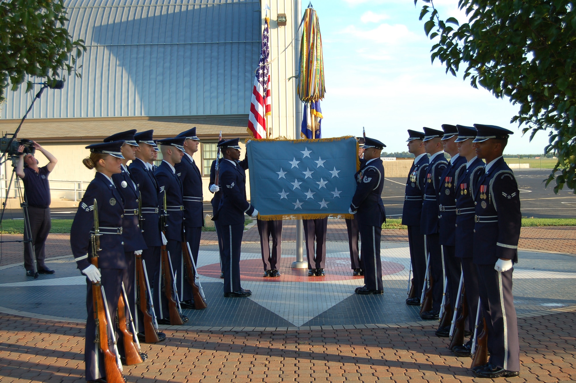 The Air Force Honor Guard from Bolling Air Force Base, Washington, D.C., was recently filmed at the Air Mobility Command Museum here for a Medal of Honor flag-folding video that will be presented to Air Force Medal of Honor recipients at the Medal of Honor Convention aboard the USS Constellation in Boston at the end of September. Every living Medal of Honor recipient or their primary next of kin will be presented the commemorative video and an American flag. (U.S. Air Force photo/2nd Lt. Nicole Langley)