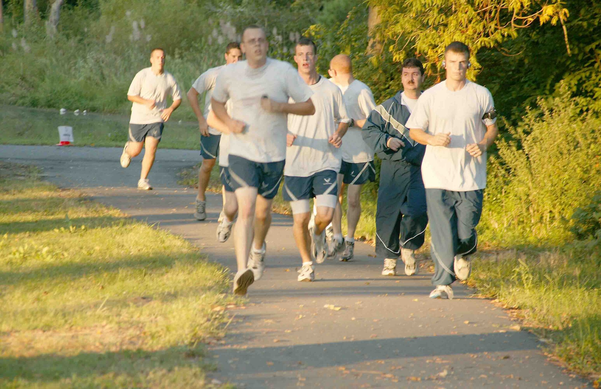 SHAW AIR FORCE BASE, S.C.-- Shaw members go for an early morning run Wednesday at the chapel trail. Physical training uniform wear will be mandatory for unit PT activities effective Oct. 1. (U.S. Air Force photo/Senior Airman John Gordinier)
