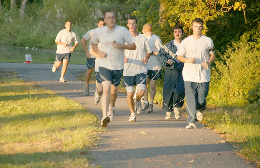 SHAW AIR FORCE BASE, S.C.-- Shaw members go for an early morning run Wednesday at the chapel trail. Physical training uniform wear will be mandatory for unit PT activities effective Oct. 1. (U.S. Air Force photo/Senior Airman John Gordinier)