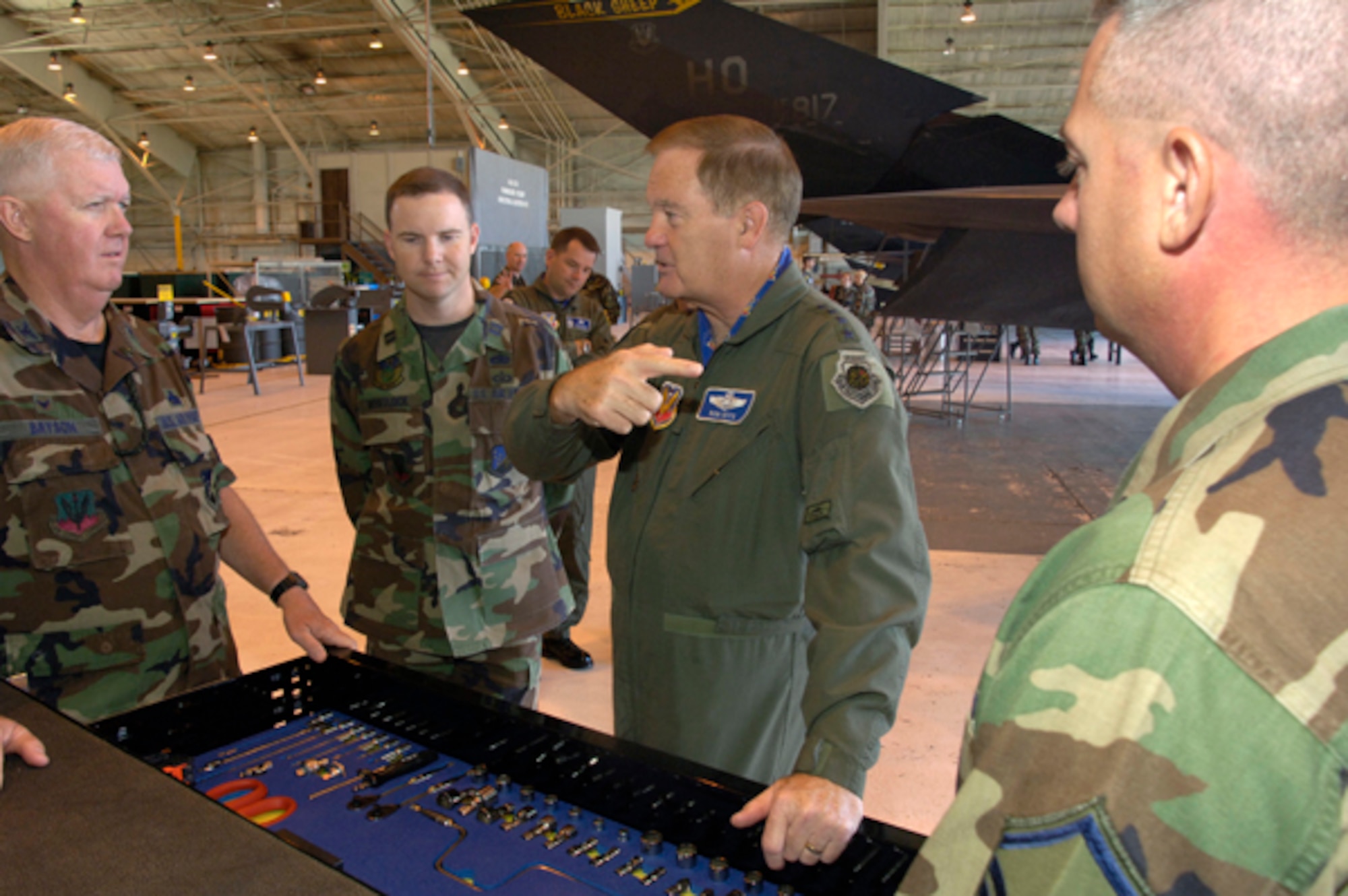 Gen. Ronald Keys discusses the maintenance of the F-117A with Col. Gary Bryson, Maintenance Group commander, during a recent visit to Holloman AFB, NM.