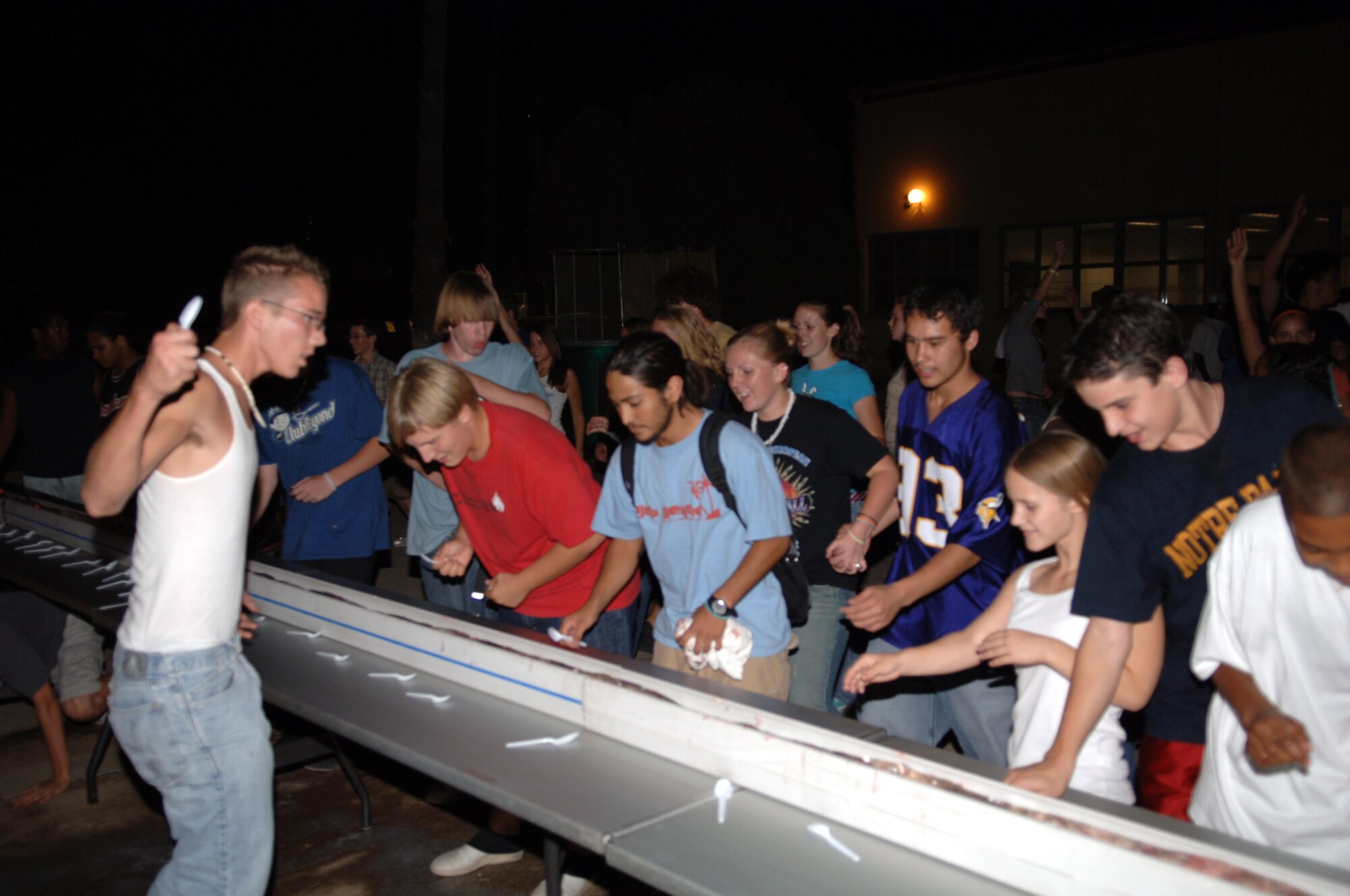 Children from Incirlik American School run toward a 50-foot banana split during Club Beyond kick off at the chapel. (U.S. Air Force photo by Staff Sgt. Chris Galindo)
