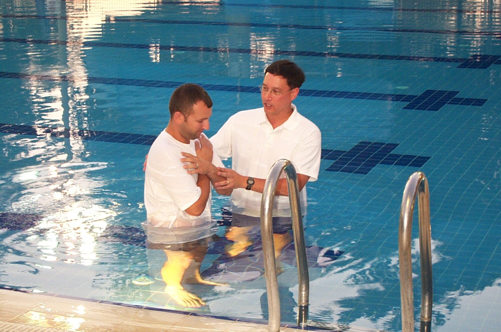 Chaplain (Maj.) Kenneth Reyes, 39th Air Base Wing Chaplain, baptizes a chapel member at the base pool. (Courtesy photo)