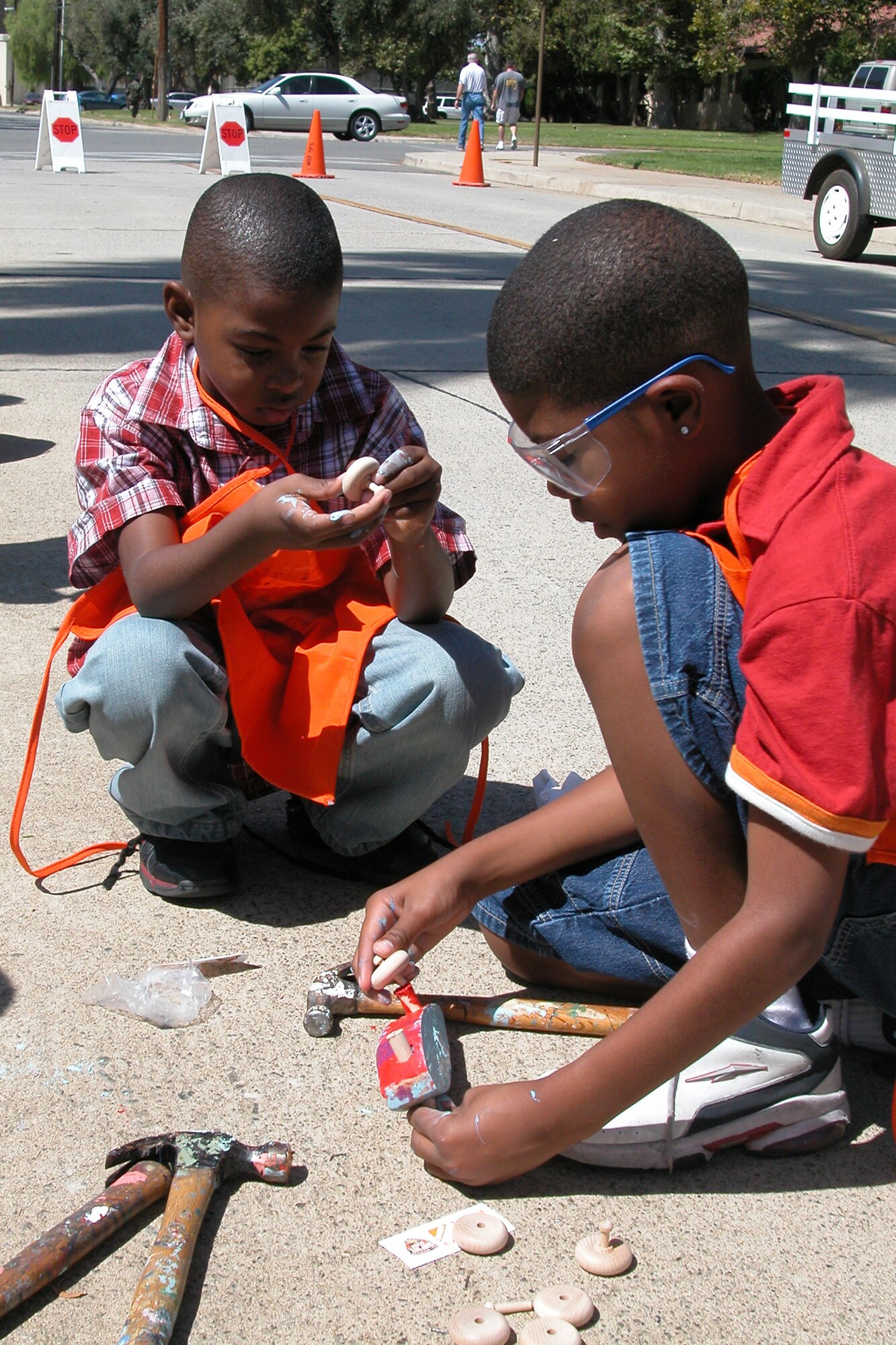 Seven-year-old Aaron, left, and his 11-year-old brother, Isiah, build a wooden model vehicle during the annual base wide picnic held on Saturday, September 16.  The local communities of Riverside and Moreno Valley organized and funded the picnic to show their appreciation to the military members who work at the base.  More than 5,000 military members and their families attended the event.  This is the 34th appreciate day picnic the community has hosted for March Air Reserve Base.  (U.S. Air Force photo by Staff Sgt. Amy Abbott) 
