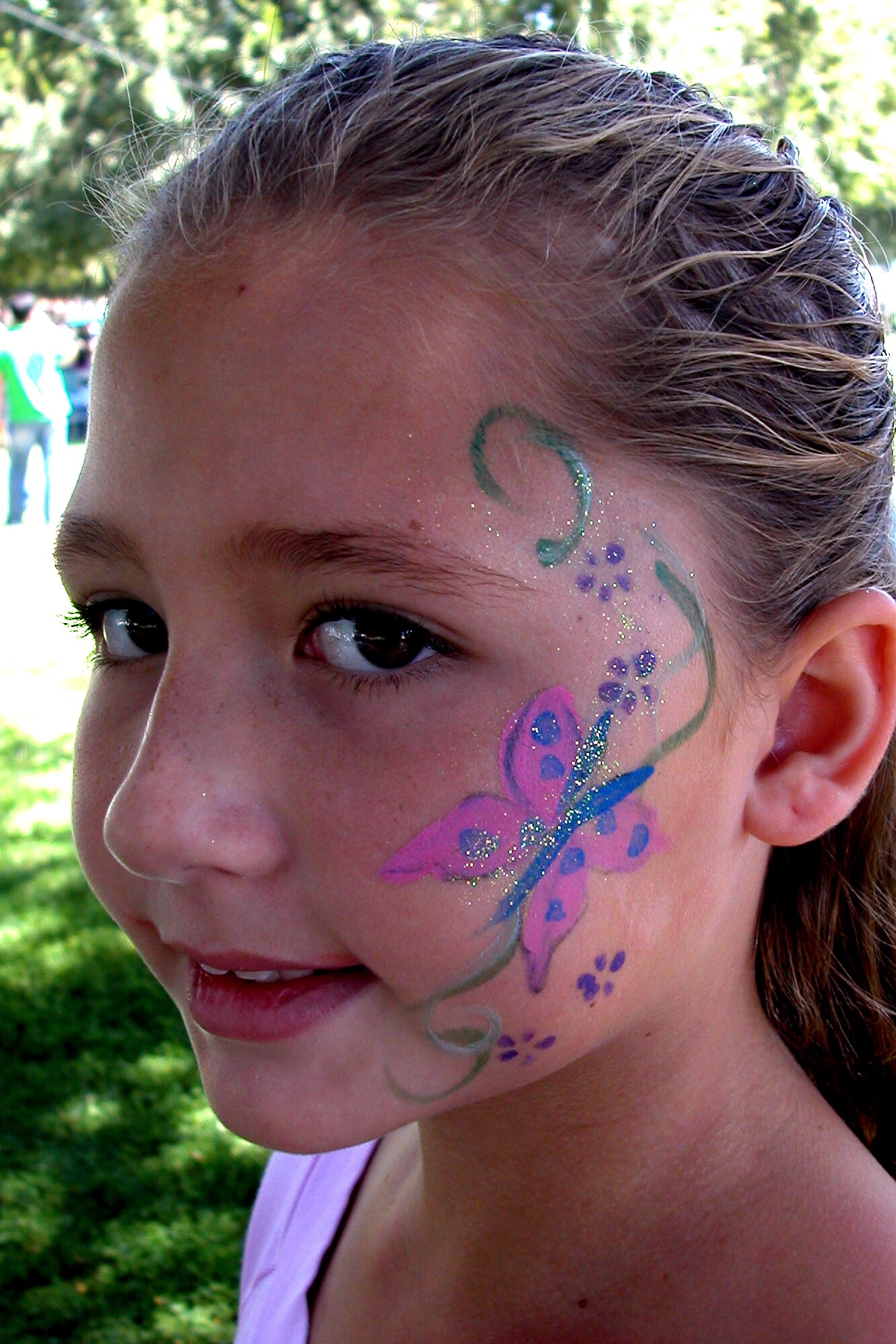 Nine-year-old Demi shows off her first face painting of the day during the annual base wide picnic held on Saturday, September 16.  The local communities of Riverside and Moreno Valley organized and funded the picnic to show their appreciation to the military members who work at the base.  More than 5,000 military members and their families attended the event.  This is the 34th appreciate day picnic the community has hosted for March Air Reserve Base.  (U.S. Air Force photo by Staff Sgt. Amy Abbott)