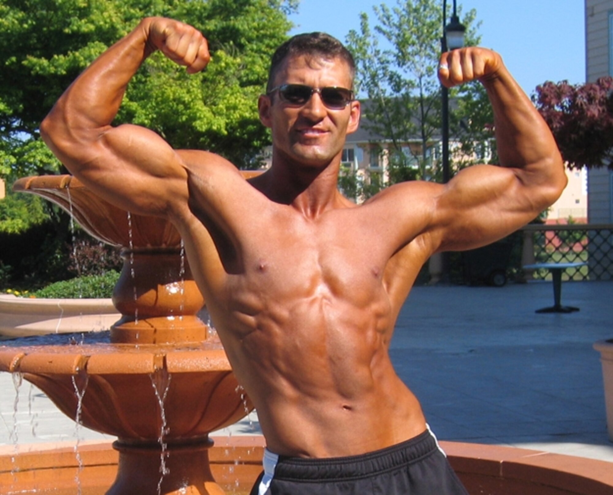 HANSCOM AIR FORCE BASE, Mass. — First Lt. Casey Turner, Air Force Research Laboratory Infrared Sensor Technology Branch Cruise Missile Detection program manager, practices posing for a bodybuilding competition this summer. (Courtesy photo)

