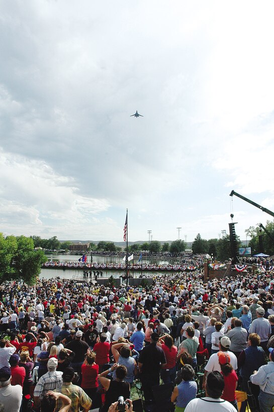 An Ellsworth B-1 flies over the state capitol grounds during the South Dakota Vietnam War Memorial Dedication Ceremony Sept. 16. The ceremony, attended by more than 32,000 was a tribute to the Vietnam War veterans and their families. Many in attendance expressed their satisfaction of the dedication, "A ceremony like this is way past due for our veterans," said Shary Haag, Rapid City resident and niece of Thurman Blackbird a Vietnam veteran. "(The organizers) did a wonderful job; it was a great dedication." For more about the memorials, go to www.sdvietnamwarmemorial.com. (Photo by 1st Lt. Carrie L. Kessler)