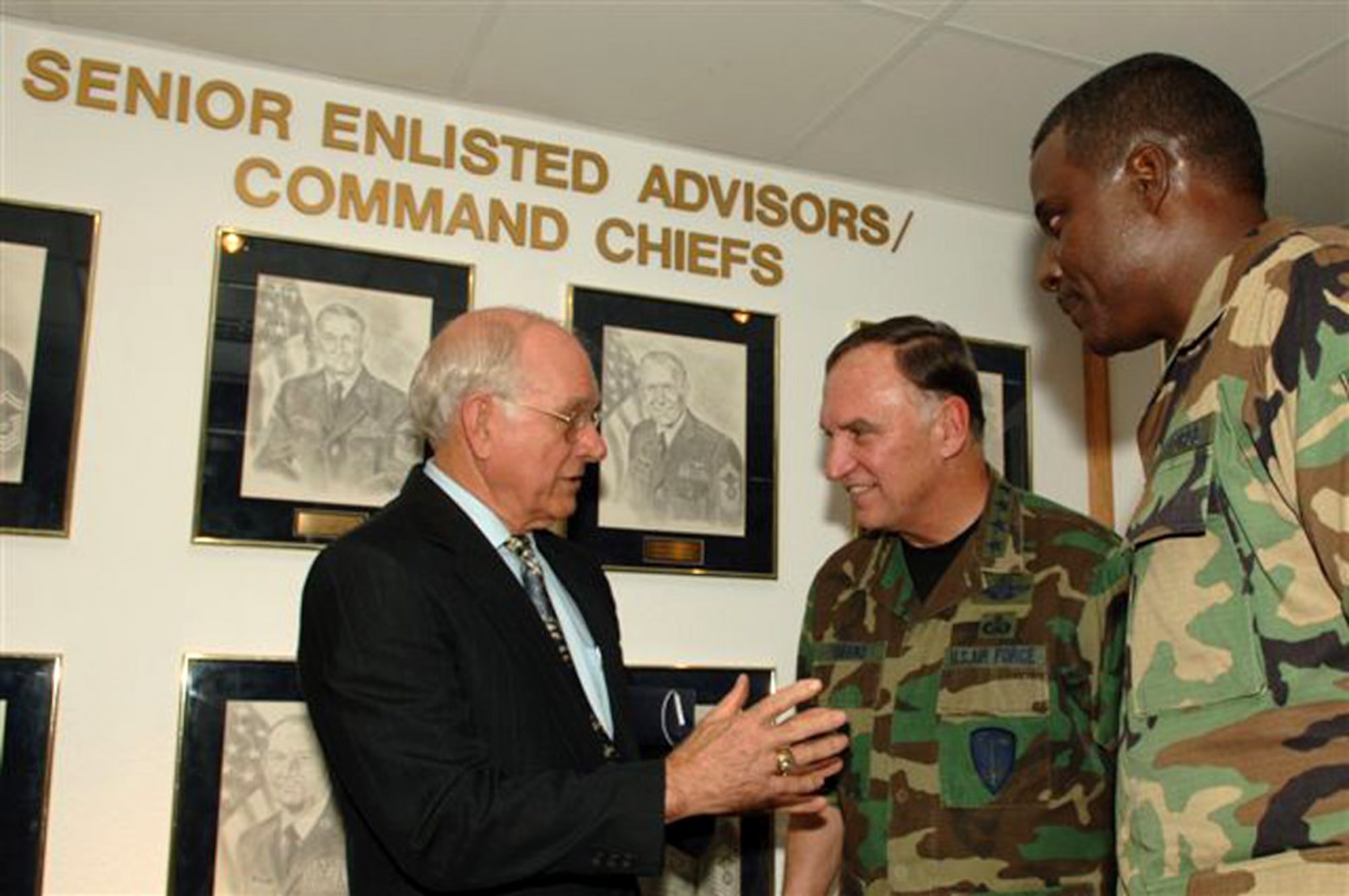 Former Chief Master Sergeant of the Air Force Sam E. Parish talks with U.S. Air Forces in Europe Commander Gen. William T. Hobbins (center) and USAFE Command Chief Master Sgt. Gary Coleman inside the Parish Enlisted Heritage Room after a ceremony marking the opening of the room bearing his name. (U.S. Air Force photo/Senior Airman Christopher Willis)