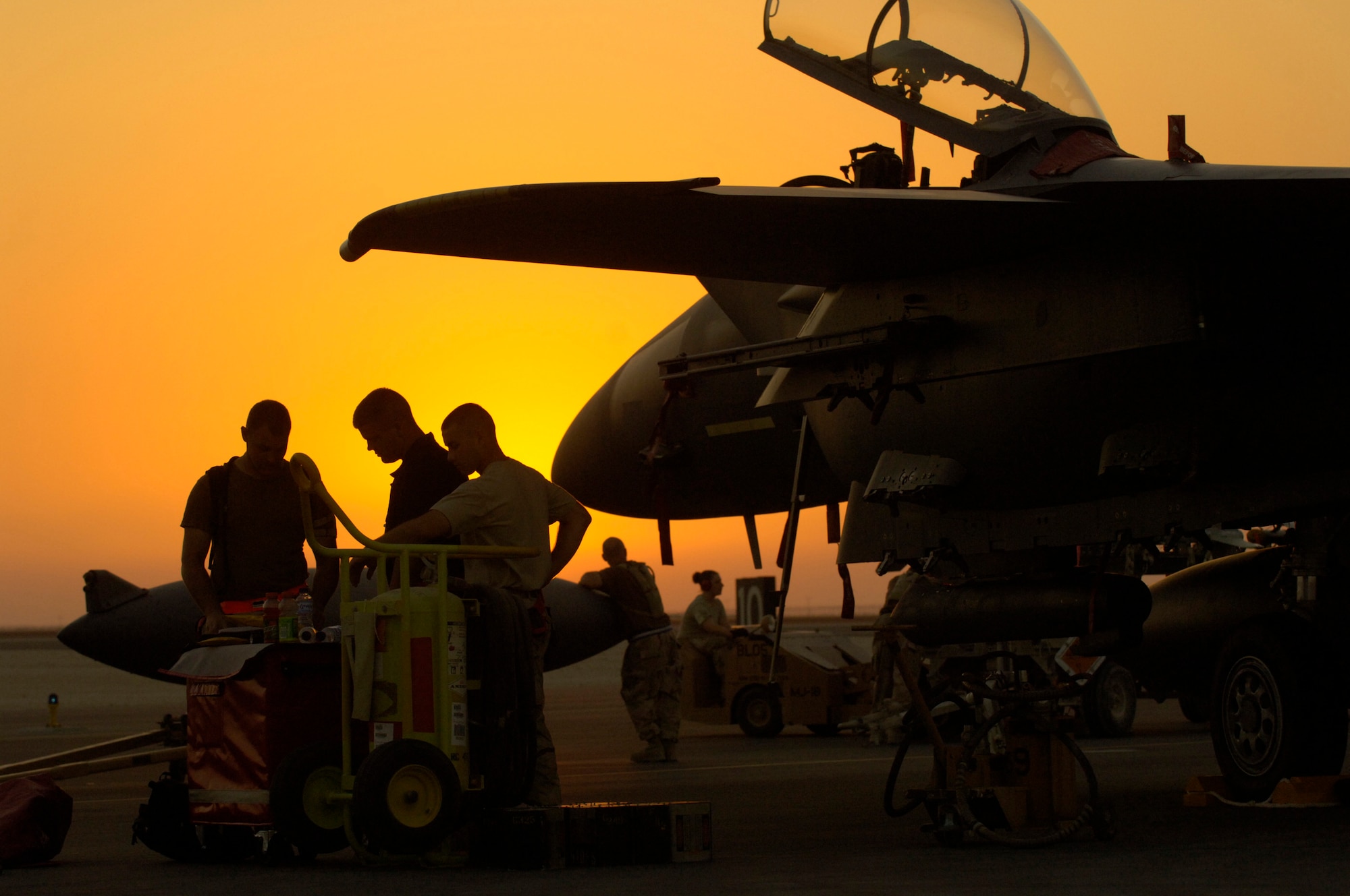 Staff Sgt. Sean Tracey, Senior Airman Sean Timothy and Airman 1st Class Henry Rodriguez perform a post-flight inspection on an F-15 Strike Eagle at a forward-deployed base in Southwest Asia Sept. 21. The three F-15E crew chiefs are assigned to the 494th Aircraft Maintenance Unit. (U.S. Air Force photo/Master Sgt. Scott Wagers) 