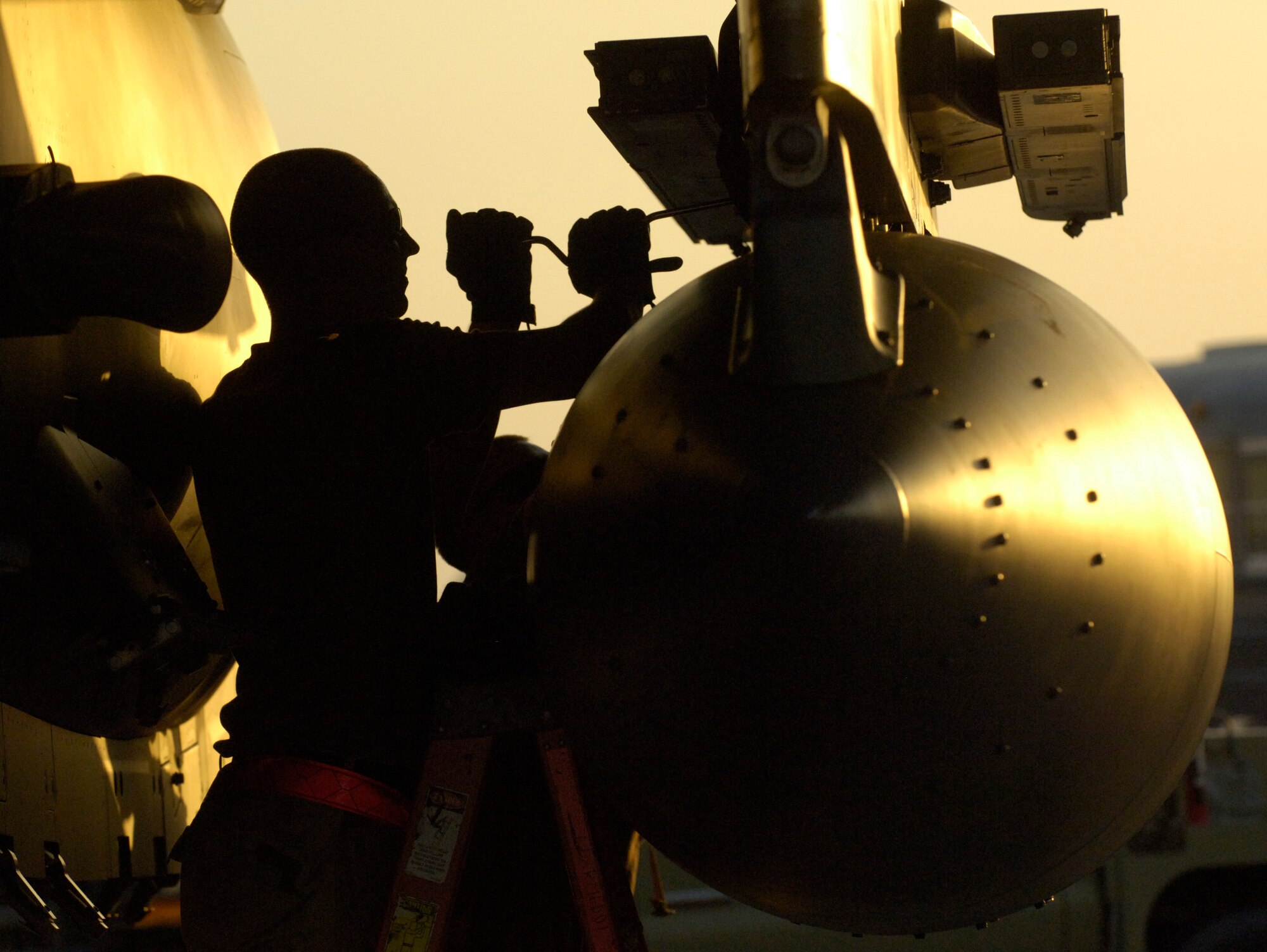 Airman 1st Class Henry Rodriguez removes an external fuel tank on an F-15E Strike Eagle at a forward-deployed base in Southwest Asia Sept. 21. The F-15E crew chief is assigned to the 494th Aircraft Maintenance Unit. (U.S. Air Force photo/Master Sgt. Scott Wagers) 

