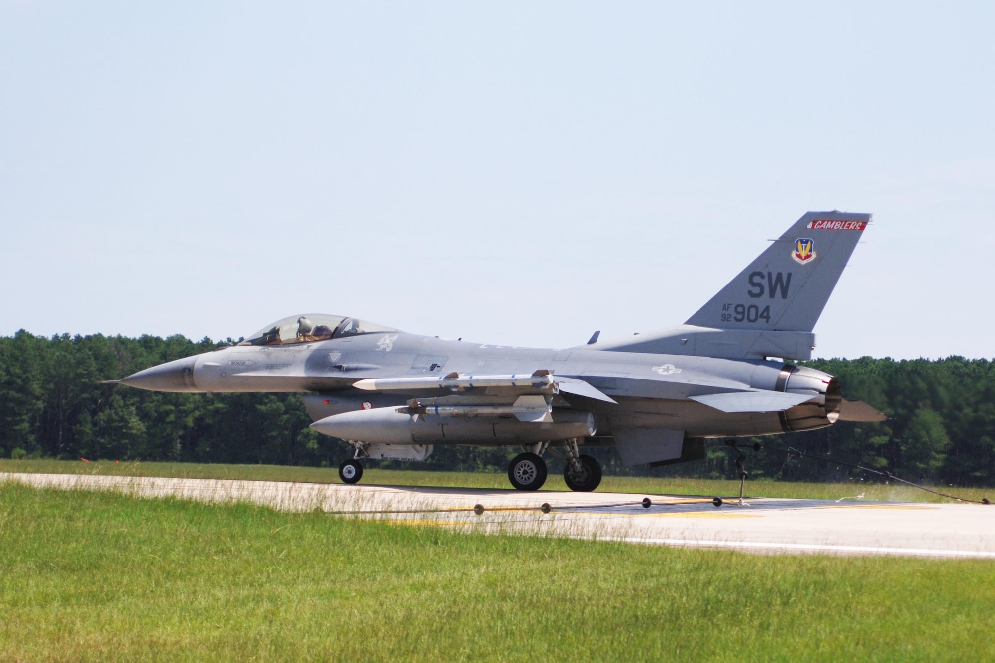 An F-16 Fighting Falcon from the 79th Fighter Squadron at Shaw Air Force Base, S.C., engages the aircraft barrier Aug. 25 during a barrier certification test. An F-16 from Shaw AFB jettisoned two external fuel tanks during a mechanical malfunction on takeoff at about 1:30 p.m. Sept. 21 on a homeland defense mission. (U.S. Air Force photo/Airman Matthew Davis)
