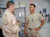 Staff Sgt. Alan Padgett (right), 437th Communications Squadron tech controller, talks with Brig. Gen. Robin Rand, 332nd Air Expeditionary Wing commander, after being awarded the Purple Heart at Ali Base, Iraq.
