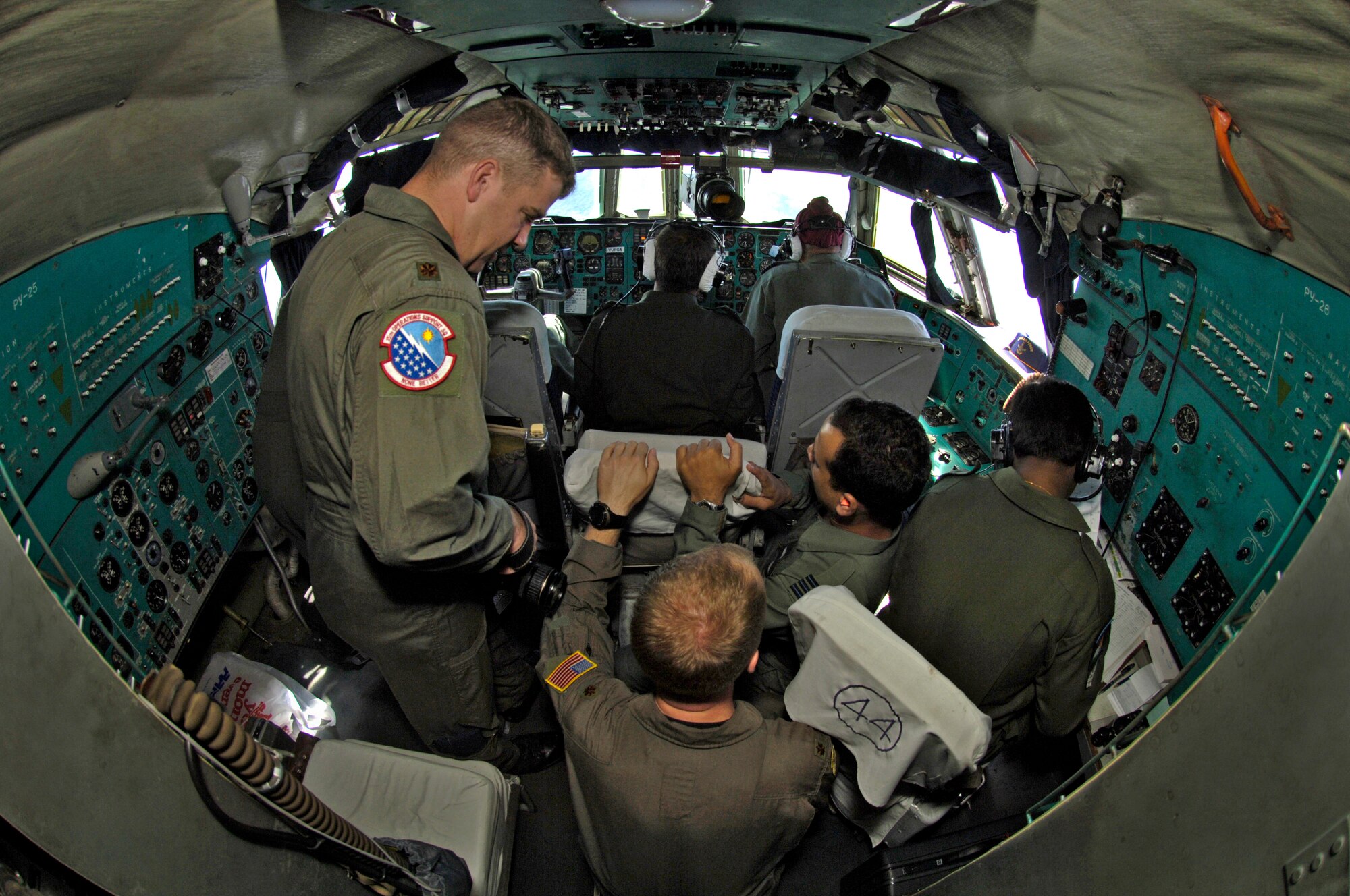 Maj.Õs Latimer Neal and Halsey Burks get a briefing in the cockpit of a Indian IL-76 medium cargo aircraft during a training mission over the big island of Hawaii Sept. 20, 2006. The Indian Air Force is flying members of the 15th Airlift Wing to show their American counter parts what their aircraft is capable of. (U.S. Air Force photo/ Tech. Sgt. Shane A. Cuomo)
