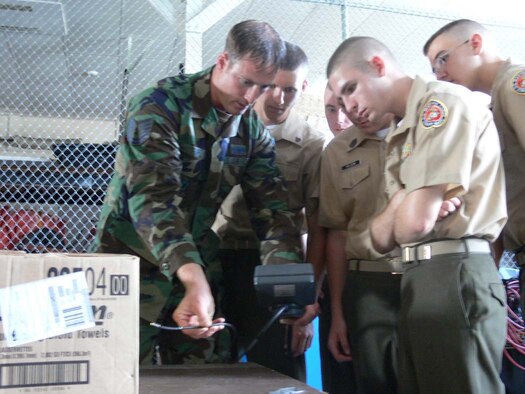 MOODY AIR FORCE BASE, Ga. -- Tech. Sgt. Heath Tempel, 347th Civil Engineer Squadron Explosive Ordnance Disposal flight section chief, shows Marine Junior Reserve Officer Training Corps cadets how to use a fiber scope during a recent tour here. Sergeant Heath was awarded a Bronze Star recently by the Army. (USAF photo by Senior Airman Leticia Hopkins)
