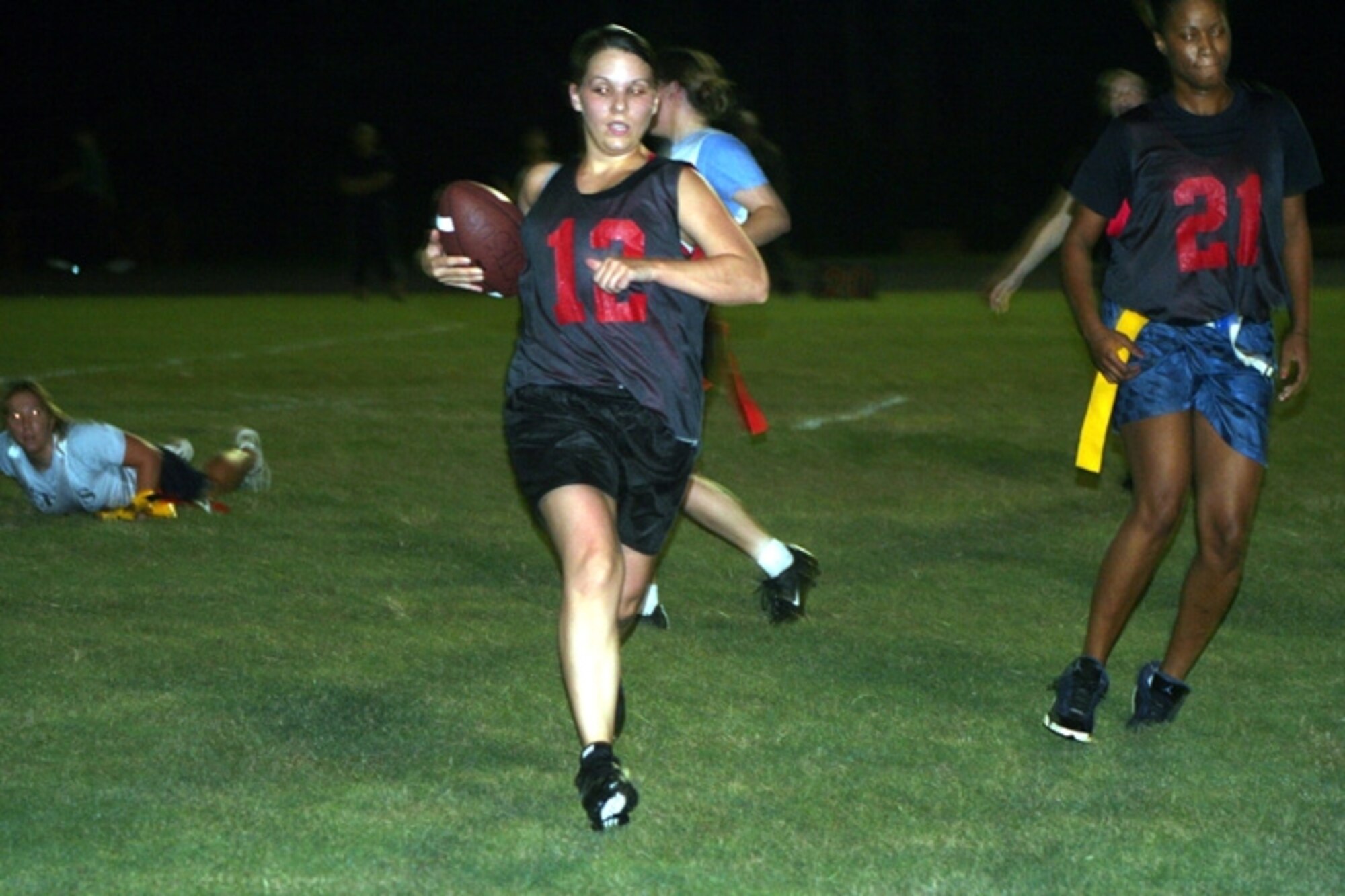 A member of Team S runs for the goal line after getting a hold of the ball during the game against Team V Sept. 13. Team V held Team S to a 24 to nothing victory. (U.S. Air Force Photograph by SSgt. Kelly Ogden)