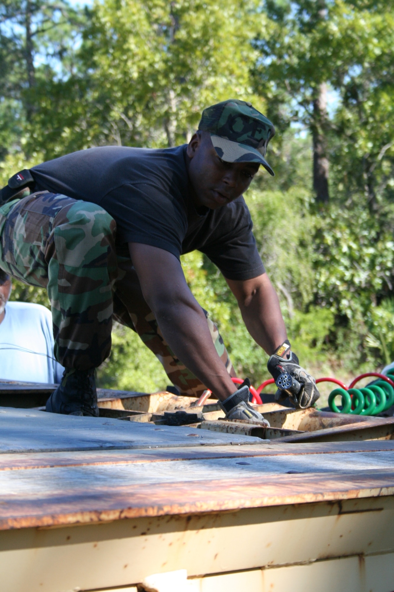 A 16th Civil Engineering Squadron Airman helps out doing maintenance at the Bob Hope Village here Thursday. (U.S. Air Force Photograph by Senior Airman James Dickens)
