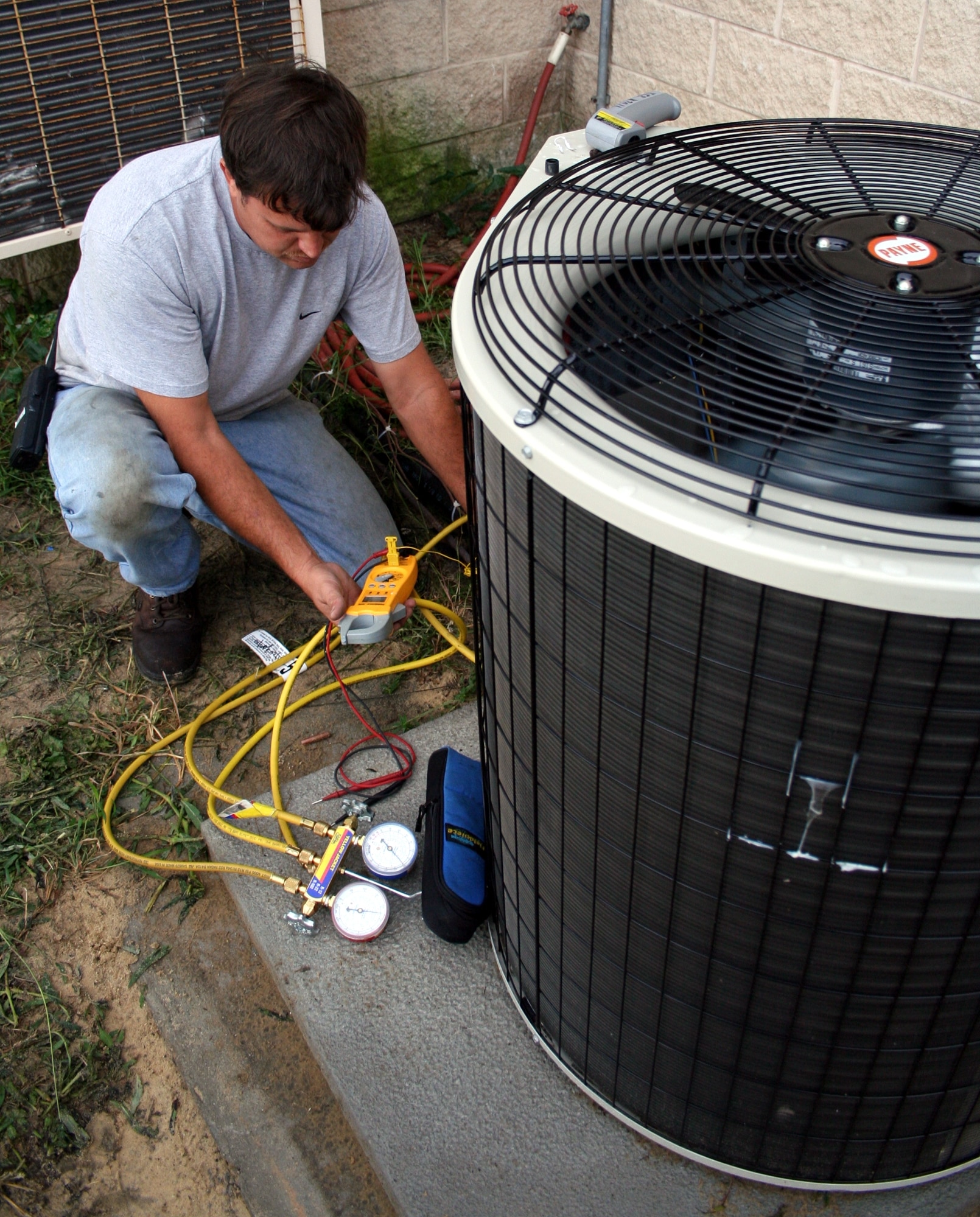 Jim Schuchard, 16th Civil Engineering Squadron Heating, Ventilation, Air Conditioning and Refrigeration Unit, monitors the refrigerant pressures after he and Senior Airman Robert McKelvey (not pictured), 16th CES HVAC/R, replaced a five-ton AC unit at a critical communications facility. (Photographs by Dylan Laurie)

