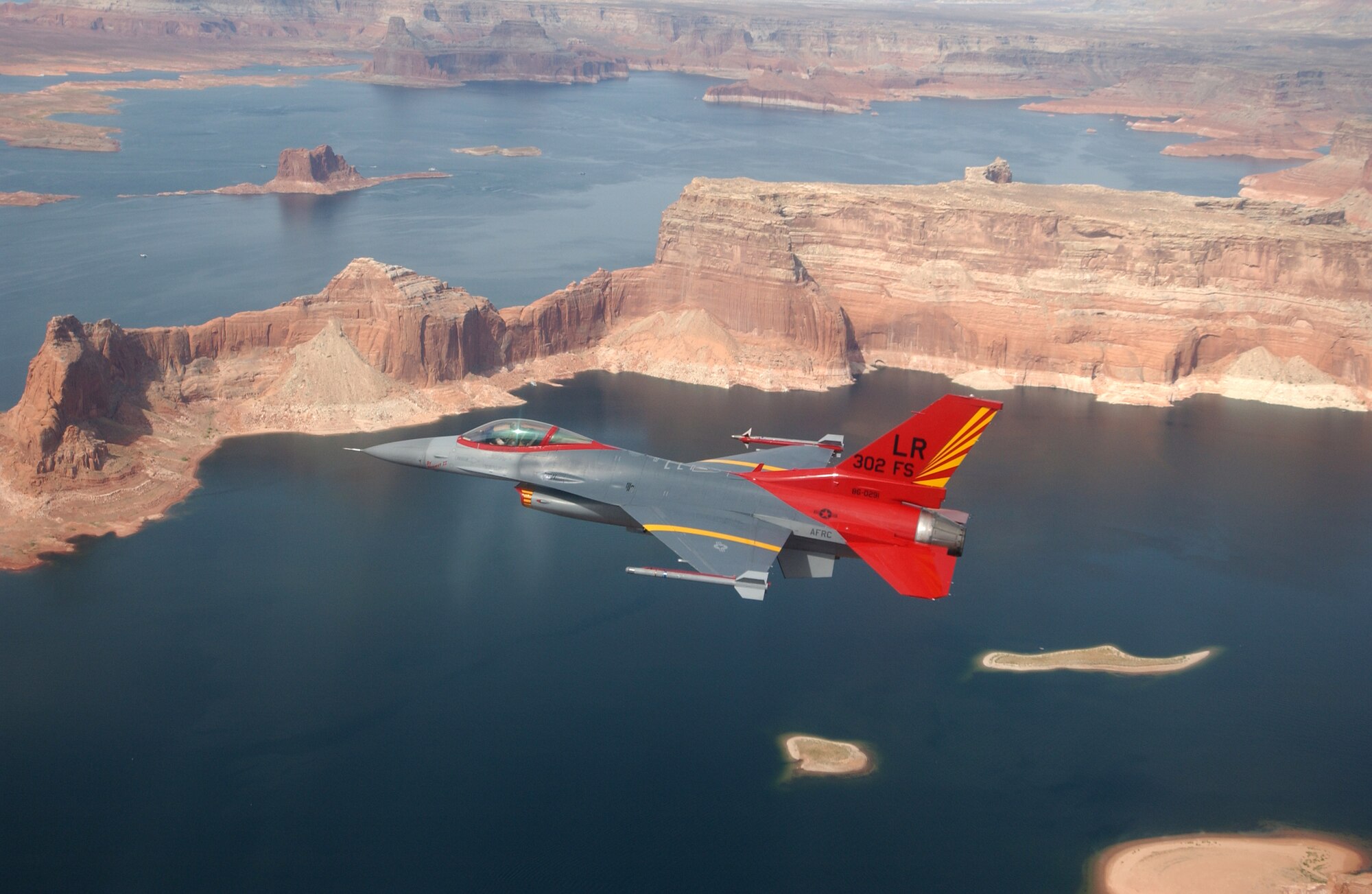 Maj. Robert Churchill, 302nd Fighter Squadron pilot, flies an F-16 Viper Sept. 21, 2006, that has been painted with the red tail to commemorate the Tuskegee Airmen of World War II. (U.S. Air Force photo/Tech. Sgt. Lee Harshman)
