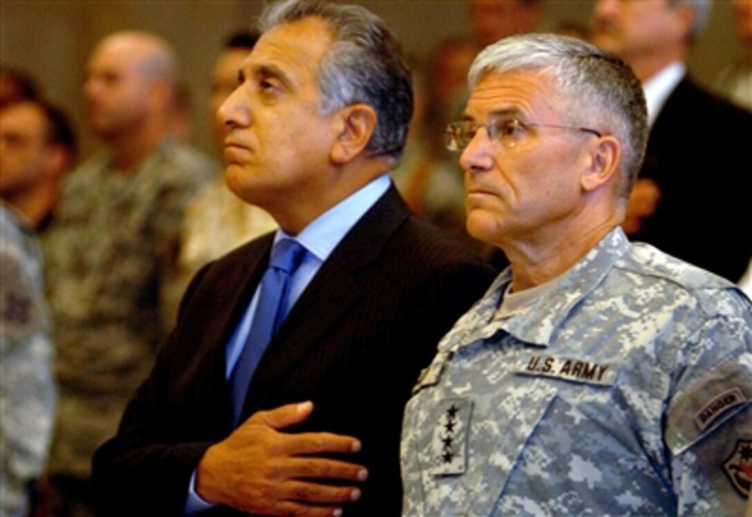 Doctor Zalmay Khalilzad, U.S. Ambassador to Iraq, and Gen. George Casey, Commanding General, Multi-National Force - Iraq, attend a transfer of security responsibility ceremony in Baghdad, Iraq, Sept. 21, 2006. 