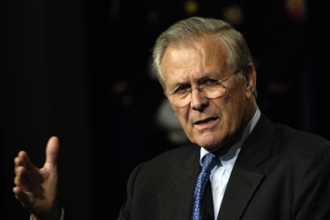 Secretary of Defense Donald H. Rumsfeld, accompanied by Chairman of the Joint Chiefs of Staff Marine Gen. Peter Pace, addresses an audience of military and DOD civilians during a town hall at the Pentagon, Sept. 22, 2006.
