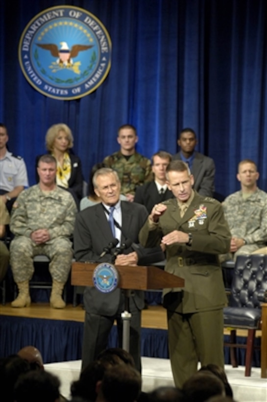 Secretary of Defense Donald H. Rumsfeld and Chairman of the Joint Chiefs of Staff Gen. Peter Pace, U.S. Marine Corps, field questions from an audience in the Pentagon auditorium during a town hall meeting on Sept. 22, 2006.  The town hall format allows both civilian and military Pentagon personnel to ask questions of their senior leaders.  