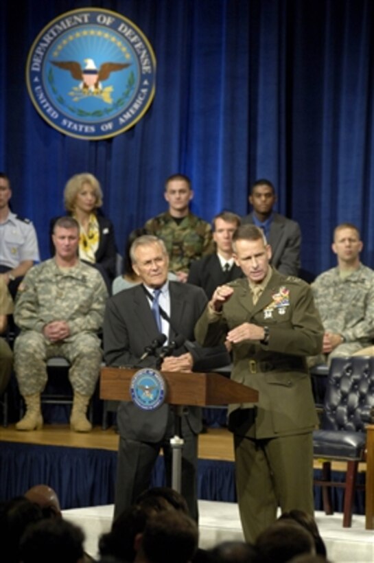 Secretary of Defense Donald H. Rumsfeld and Chairman of the Joint Chiefs of Staff Gen. Peter Pace, U.S. Marine Corps, field questions from an audience in the Pentagon auditorium during a town hall meeting on Sept. 22, 2006.  The town hall format allows both civilian and military Pentagon personnel to ask questions of their senior leaders.  