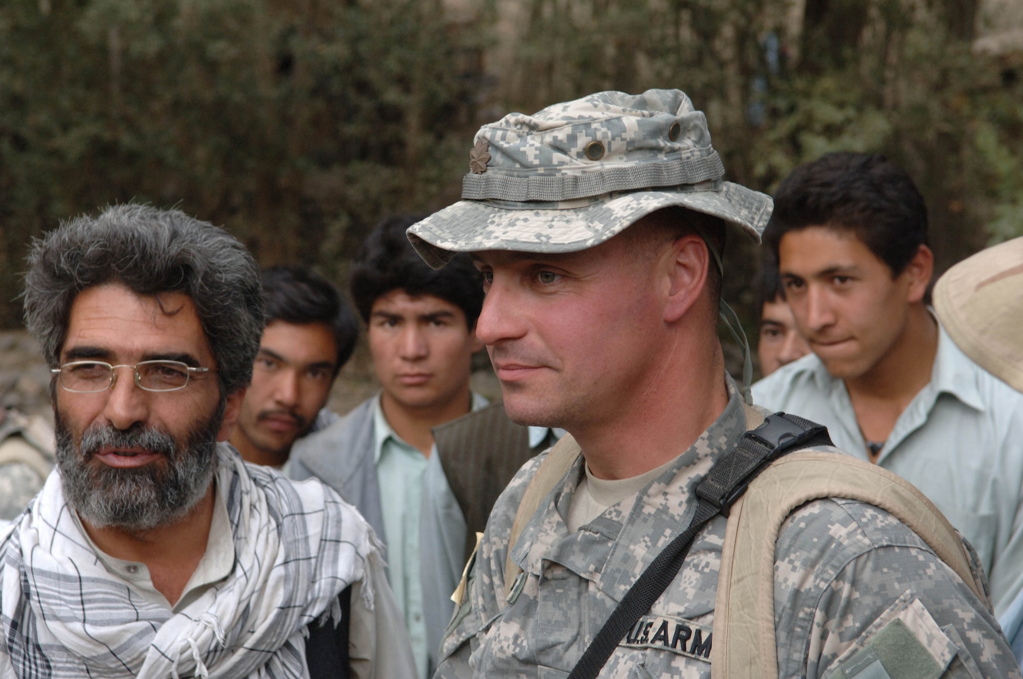 Army Major Don Johnson, Bagram PRT team leader, along with a local contractor, survey the new Diyar Bridge at its new grand opening.  This bridge was one of two that were opened recently on a three-day mission in the Parwan province.  It is one of many projects that the team has completed in its mission to help rebuild Afghanistan.  (U.S. Air Force photo/Tech. Sgt. Joseph Kapinos)