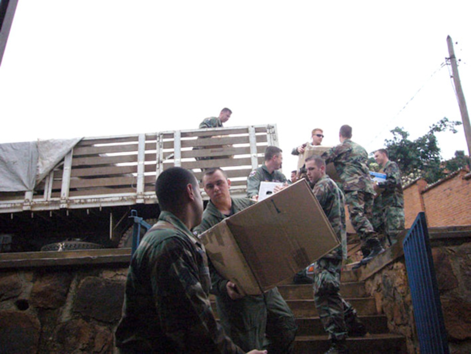 Airmen drop off boxes of blankets, school supplies and clothing at an orphanage in Kigali, Rwanda, Sept. 22. The donations were collected from various Air Force and Army units in the Kaiserslautern Military Community. (U.S. Air Force photo/Capt. Erin Dorrance) 