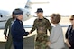 Gen. Duncan J. McNabb, Air Mobility Command commander, is greeted by Col. Bill Spacy, 305th Air Mobility Wing vice commander, and Barbara Martin, wife of Col. Rick Martin, 305th AMW commander, here Wednesday. General McNabb will be the guest speaker at the Air Force birthday celebration at McGuire Saturday. Photo by Kenn Mann