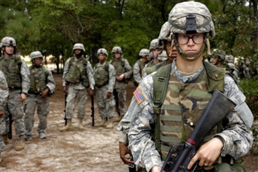 U.S. Army recruits wait their turn to go through the convoy live-fire course during Army basic training at Fort Jackson, S.C., Sept. 19, 2006.  Basic combat training is the first step toward a very challenging and rewarding experience in service to the nation.
