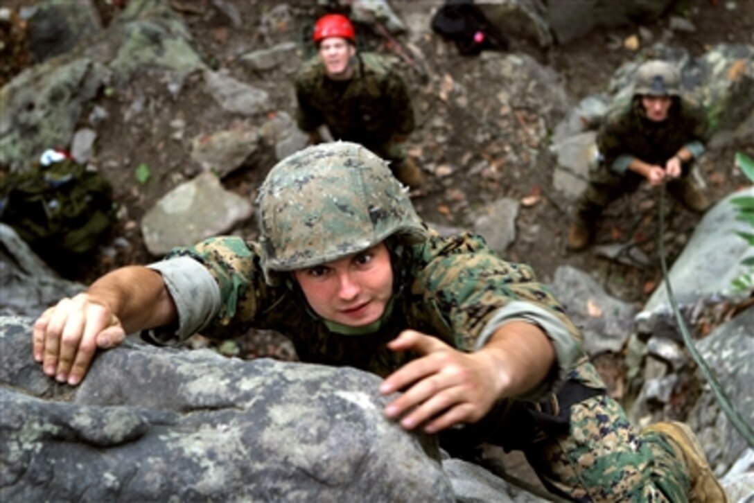 U.S. Marine Cpl. Chance P. Reynolds, a squad leader with Fox Company, Battalion Landing Team, 2nd Battalion, 2nd Marine Regiment, 26th Marine Expeditionary Unit, performs a top-rope climb at the lower cliffs area of Cheat Lake, W. Va., Sept. 19, 2006, during a 10-day Rough Terrain Familiarization Course. 