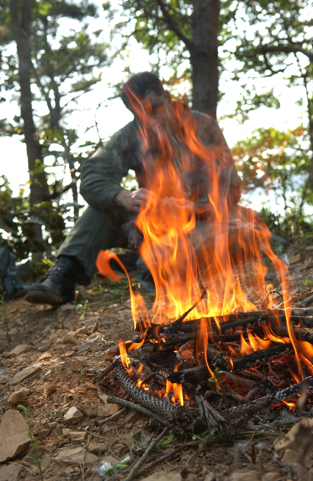 Maj. Paul Neidhardt takes a break after a day of combat search and rescue training Sept. 21 near Osan Air Base, South Korea. Annual training is conducted by survival, evasion, resistance and escape instructors to reacquaint aircrew members with combat search and rescue procedures and techniques. Major Neidhardt is with the 25th Fighter Squadron at Osan AB. (U.S. Air Force photo/Airman 1st Class Chad Strohmeyer)
