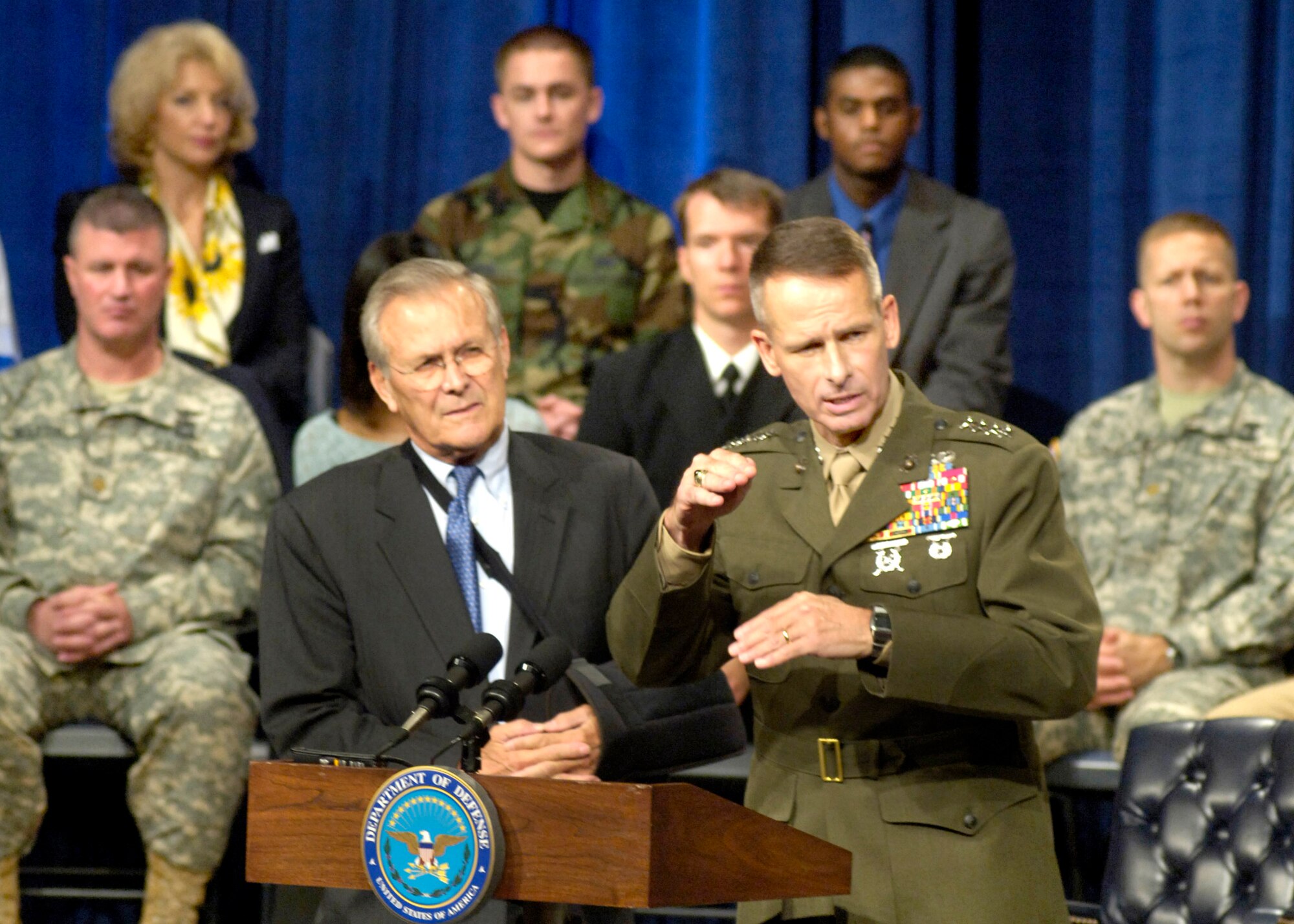 Secretary of Defense Donald H. Rumsfeld and Chairman of the Joint Chiefs of Staff Marine Corps Gen. Peter Pace field questions from an audience in the Pentagon auditorium during a town hall meeting Sept. 22.  The town hall format allows Pentagon personnel, both civilian and military, to ask questions of their most senior leaders.  (Department of Defense photo/R.D. Ward)