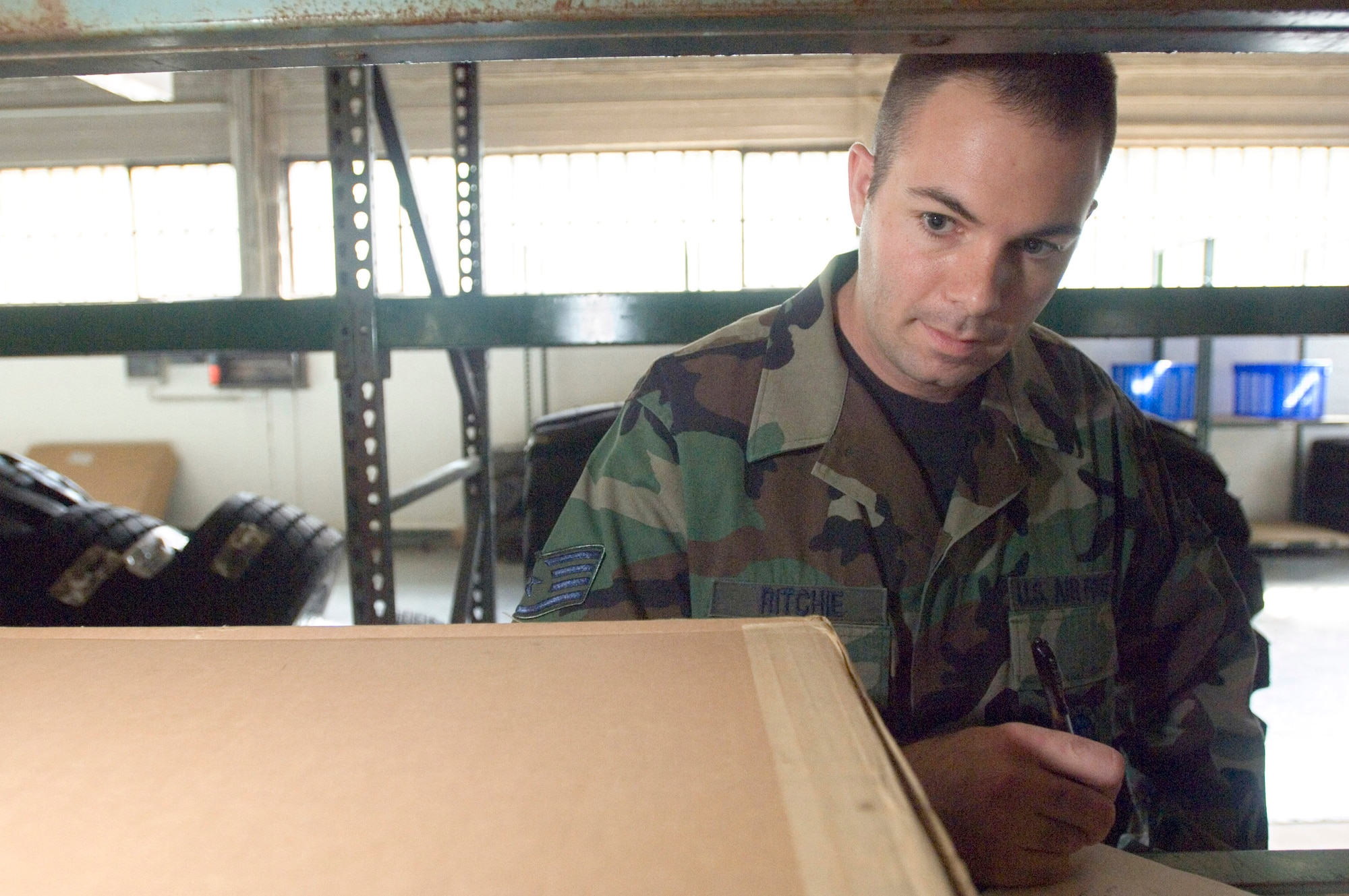 Staff Sgt. Brad Ritchie checks stock levels in the vehicle maintenance shop Sept. 20 at Sembach Air Base, Germany. Sergeant Ritchie is a supply journeyman with Sembach's 435th Materiel Maintenance Squadron. (U.S. Air Force photo/Master Sgt. John E. Lasky) 