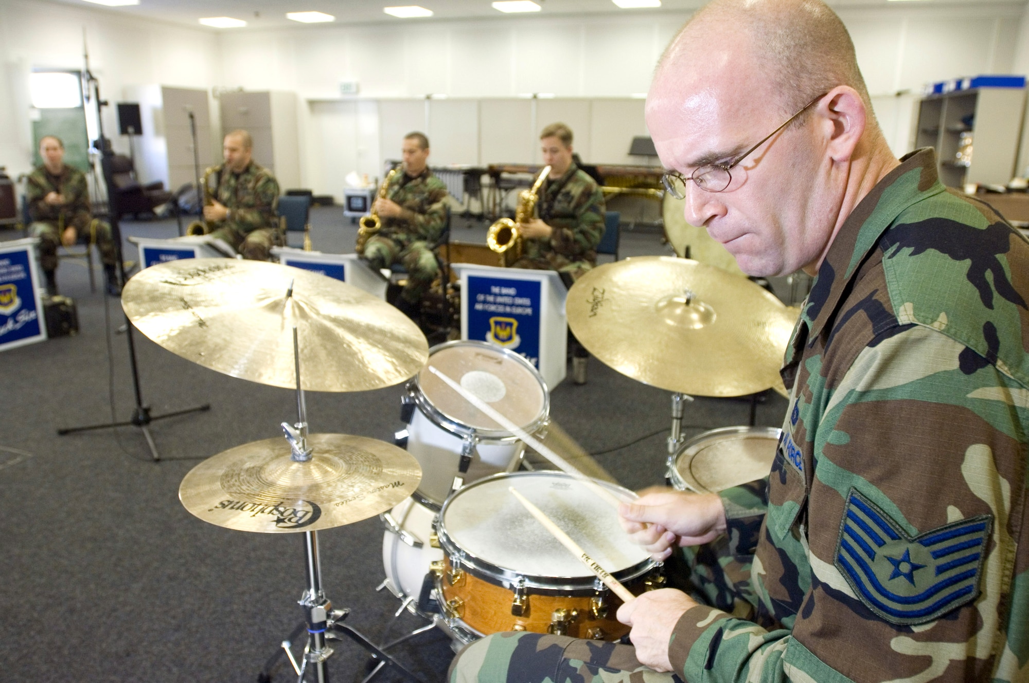 Tech. Sgt. Paul Shaw follows the note sheet during U.S. Air Forces in Europe Band rehearsals at Sembach Air Base, Germany, Sept. 22. Sergeant Shaw keeps the music moving in time for USAFE's jazz band Check Six. They perform music ranging from big band styles of the '40s to the pop music of today. (U.S. Air Force photo/Master Sgt. John E. Lasky) 
