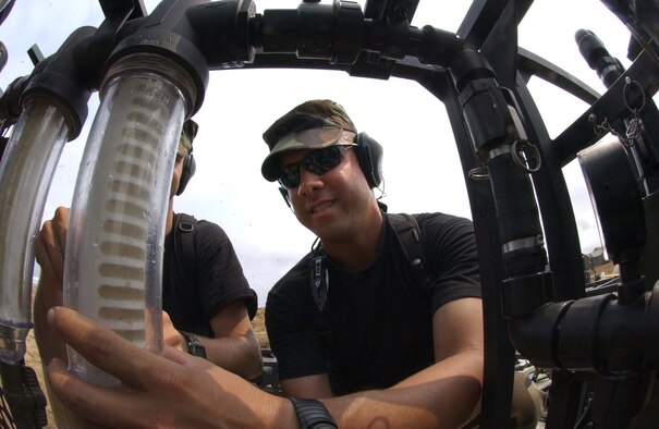 Tech. Sgt. Hector Nieves, a crew chief with Ramstein’s 86th Contingency Response Group, is part of the Reverse Osmosis Water Purification Team assigned to the 212th Mobile Army Surgical Hospital to provide purified water for the nearly 200 personnel currently assigned to the MEDFLAG 2006 joint task force in Angola, Africa.  Every day, the five-man team purifies over 3,000 gallons of sea water for the deployed MASH Unit. Photo by Airman 1st Class Kristi Mulder