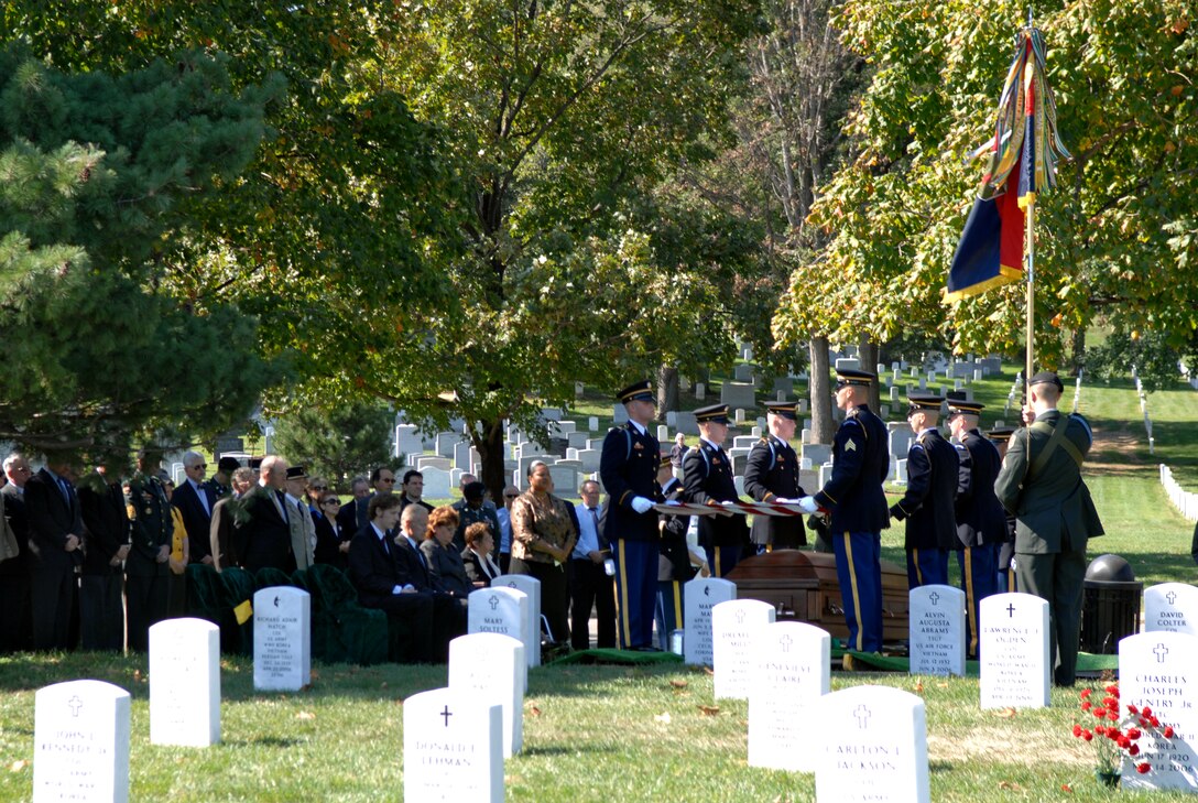 Soldiers of the 3rd U.S. Infantry fold the flag draped over the casket of formerly missing U.S. Army Pvt. Francis Lupo in Arlington National Cemetery Sept. 26. Lupo was killed in World War I in 1918 in France. Photo by William D. Moss