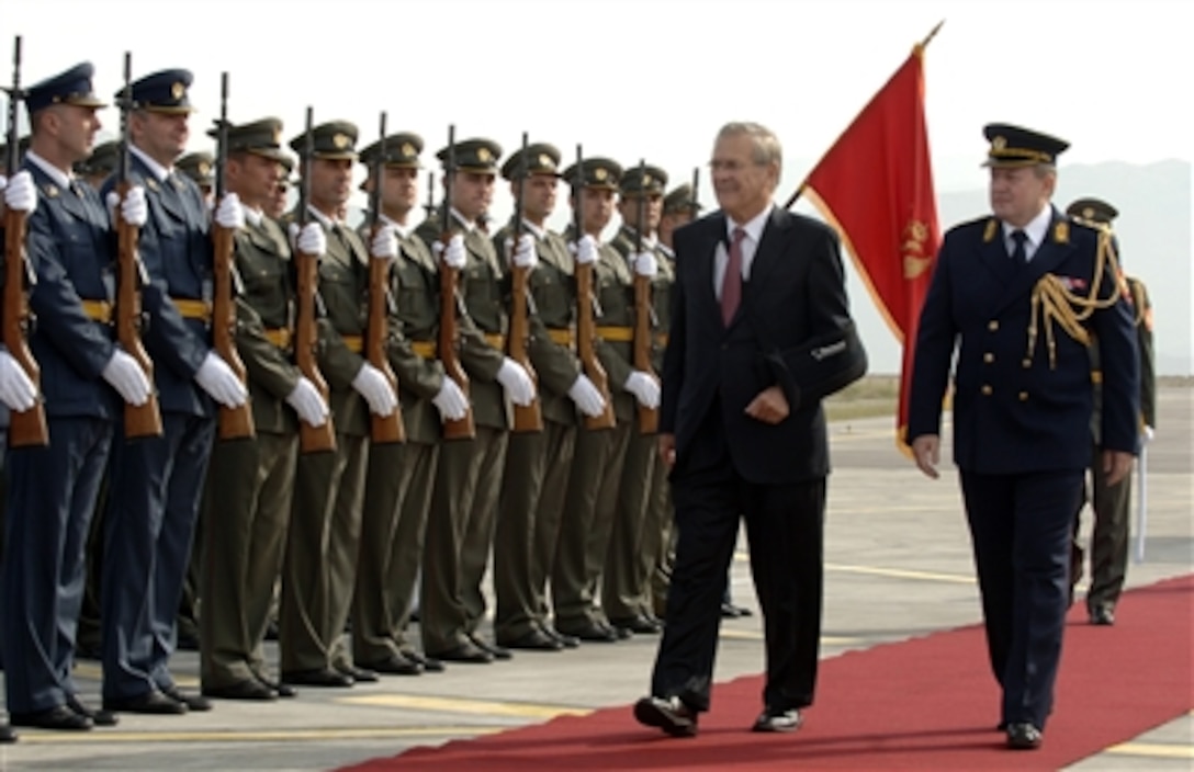 Defense Secretary Donald H. Rumsfeld is escorted by Lt. Gen. Jovan Lakcevic, chief of general staff, during an honor cordon at Podgorica Airport, Montenegro, Sept. 26, 2006. Rumsfeld is visiting Montenegro, the world’s newest country, to recognize its independence and encourage its integration with the rest of Europe. 