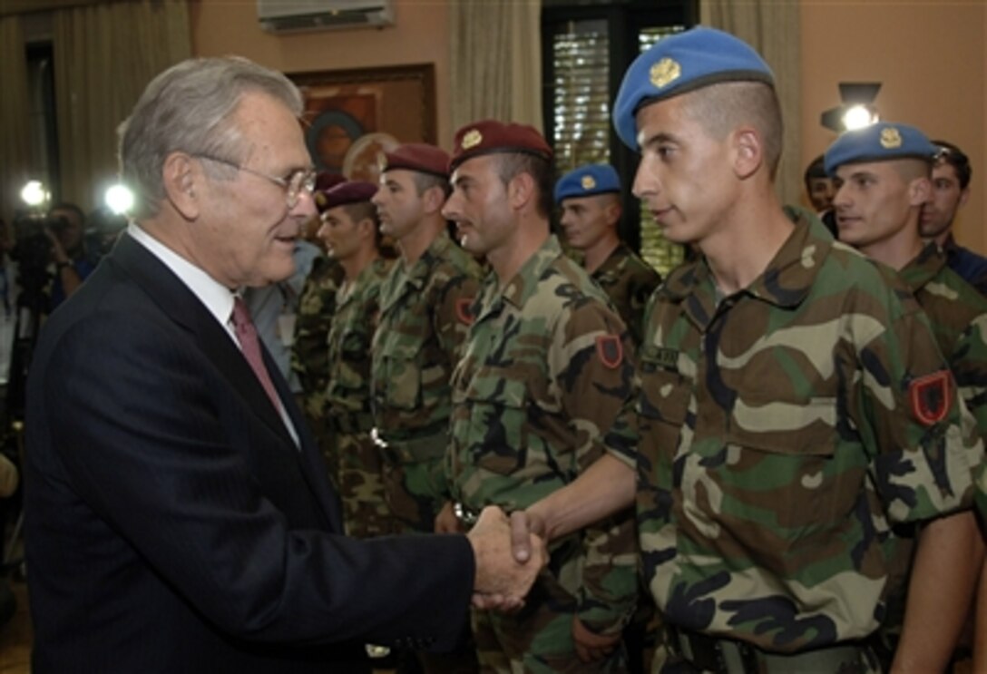 Defense Secretary Donald H. Rumsfeld presents the Global War on Terror Medallion to Albanian soldiers.  Rumsfeld is visiting Albania to attend the South Eastern European Defense Ministerial.
