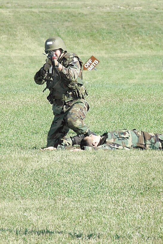 An Ellsworth Airman engages the enemy at close range with his M-16A-2 rifle. The M-16A-2 is capable of firing in semi-automatic or automatic three-round bursts. (Photo by Senior Airman Joshua Moshier)